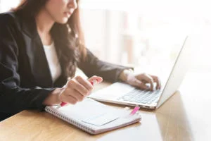 woman taking an online course on a laptop
